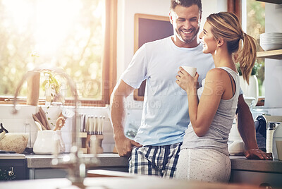 Buy stock photo Smile, couple and drinking coffee in home kitchen for conversation, chat and morning. Tea, happy man and woman together for connection, love or laugh at funny joke for bonding with partner in house