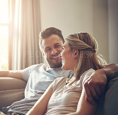 Buy stock photo Home, relax and couple with hug on sofa for comfort, support and bonding together on weekend. Man, woman and embrace with love in living room for happiness, affection and commitment in marriage