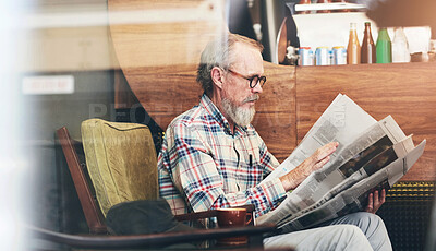 Buy stock photo Newspaper, cafe and senior man reading business information for financial stock market. Window, glasses and elderly male person enjoying economy headlines in journalism article in coffee shop.