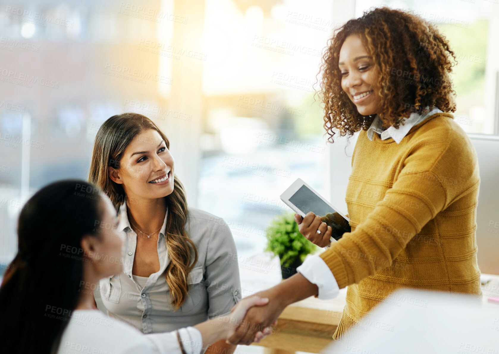 Buy stock photo Team, business women and handshake for deal, partnership or b2b collaboration opportunity. Tablet, shaking hands and happy group of people together for introduction, thank you and welcome to startup