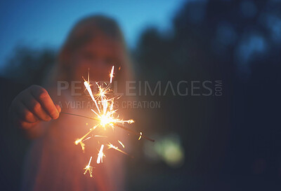 Buy stock photo Girl, child and outdoor with sparkler in night for celebration, excitement and glow in dark with entertainment. Female kid, nature and fireworks for magic or party, youth and fun for festive joy.