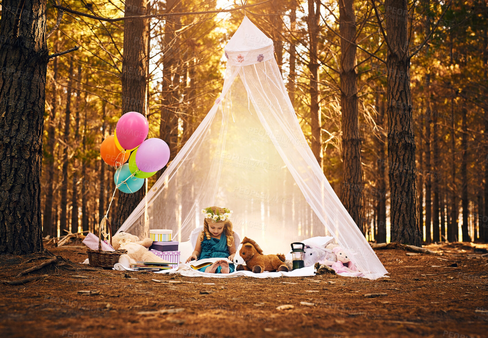 Buy stock photo Picnic, girl child and reading book in forest for development, education or fairytale story. Nature, fantasy and young kid on blanket with costume for relax, weekend adventure or literature in Canada