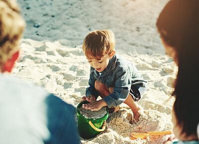 Buy stock photo Play, beach and boy with parents, sand and sunshine with vacation, getaway trip and bonding together. Happy family, mother and father with son, seaside and toys with holiday, summer and weekend break