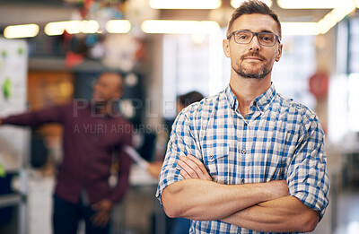 Buy stock photo Portrait, creative and business man with arms crossed in startup office for pride in career or job. Glasses, face and confident professional entrepreneur, copywriter and employee coworking at company