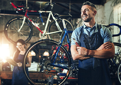 Buy stock photo Man, smile and arms crossed at work in bicycle repair shop or maintenance garage. Bike, mechanic and service with a professional handyman for startup thinking, small business and workshop for fixing
