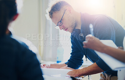 Buy stock photo Creative, man and writing on paperwork in office for planning, brainstorming and designer ideas for new agency task. Male employee, documents and working on project management, thinking and schedule.