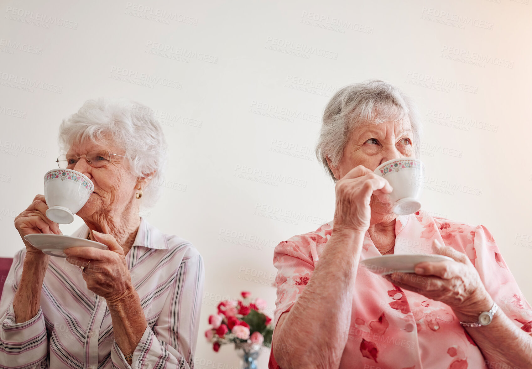 Buy stock photo Happy, relax and senior women with tea, house and bonding together with break, smile and friends. Old people, nursing home and mature ladies with cup for coffee, herbal beverage and care in lounge