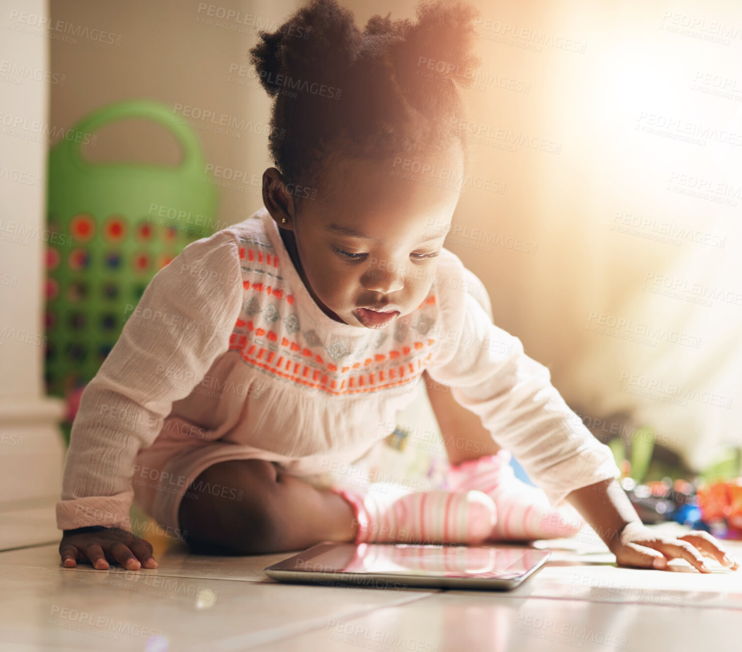 Buy stock photo Home, floor and black baby with learning on tablet for cognitive, skills and child development. Girl, kid and reading with technology on ground for education, growth and online sensory entertainment