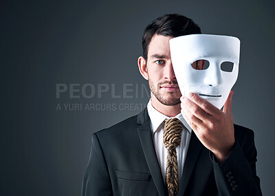 Buy stock photo Portrait, business man and spy with mask in studio isolated on gray background. Fake face, suit and industrial espionage disguise of agent with rope noose for secret identity, confidential or fraud