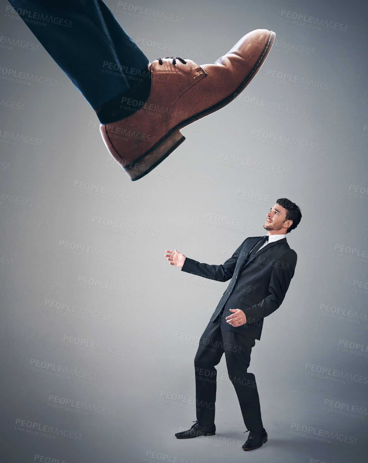 Buy stock photo Business, foot and man in suit, scared or small in studio, mockup space or bullying of corporate. Leg, walking and step on person with fear, employee or struggle of power with boss in grey background