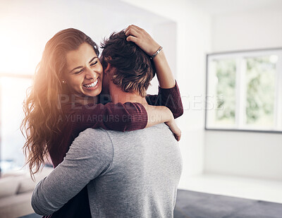 Buy stock photo Couple, woman hug and laughing in home kitchen with love, bonding and smile together with joy. Embrace, romance and happy people with marriage with care, trust and commitment in house with fun joke