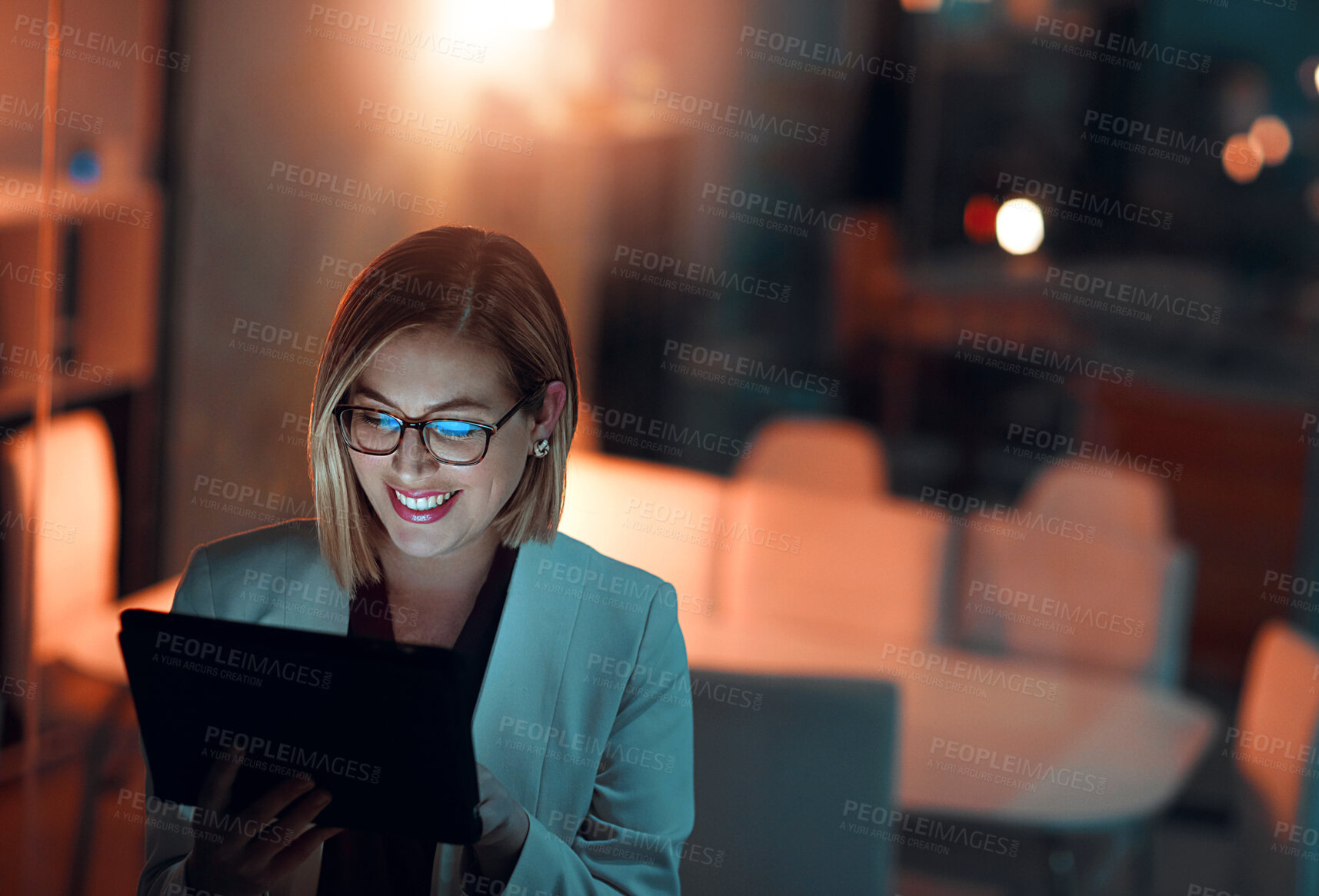 Buy stock photo Corporate woman, tablet and smile at night in office for company agenda, research and planning. Executive, technology and reading email or report for business results, growth and revenue with data