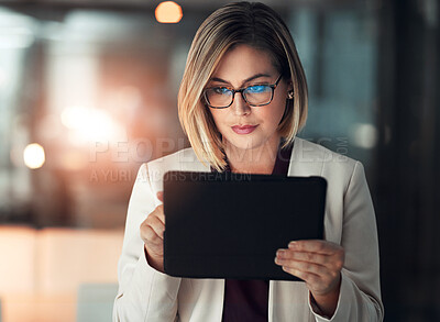 Buy stock photo Corporate woman, tablet and working at night in office for company agenda, research and planning. Executive, technology and reading email or report for business results, growth and revenue with data