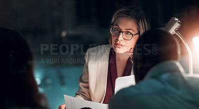 Buy stock photo Night, meeting and businesswoman in office with partner, documents and planning in corporate workplace. Female lawyer, legal team or overworked with staff for review, discussion or strategy for court