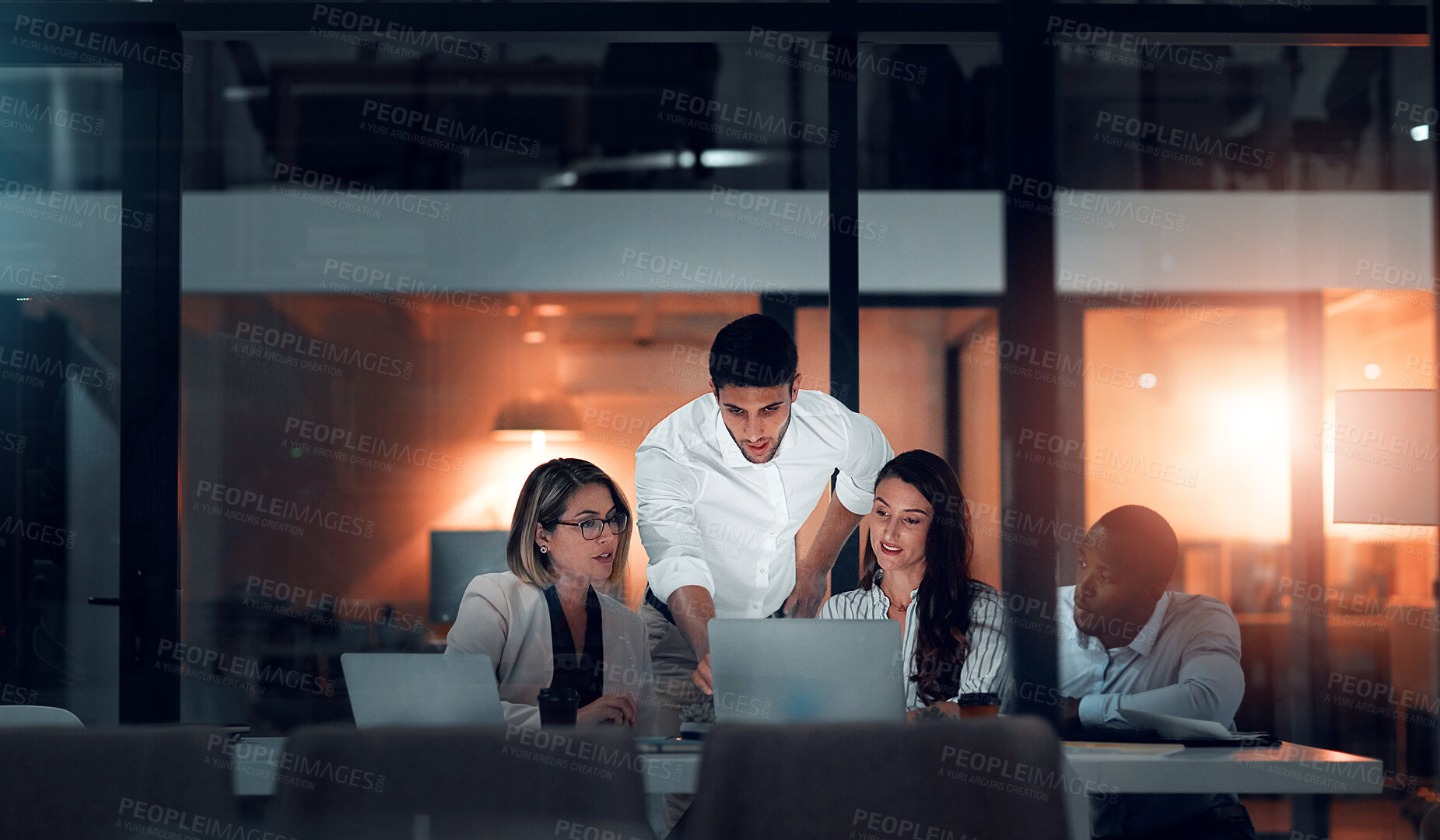 Buy stock photo Business people, meeting and laptop in office at night for project development, collaboration or conversation. Discussion, diversity and employees with deadline for teamwork, planning or support