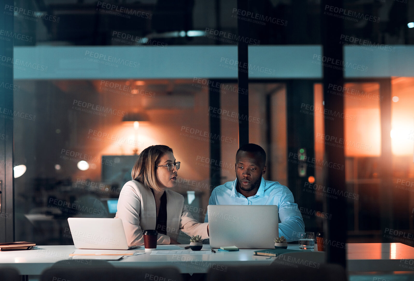 Buy stock photo Employee, people and laptop in office at night with documents for deadline or overtime as accountant. Business, partner and data capture for financial reviews, records and auditing in company account