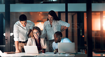 Buy stock photo Collaboration, team diversity and office at night for deadline, strategy and explanation with laptop. Female leader, group and workshop for learning, growth and development in workplace in evening