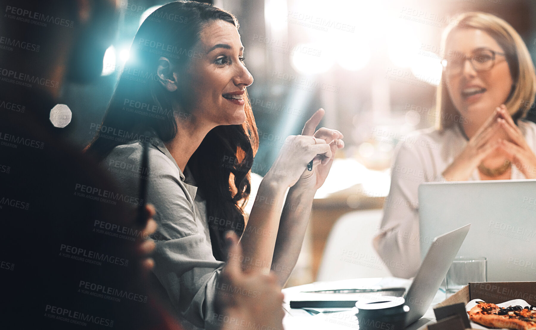 Buy stock photo Woman, team and business people planning, discussion or manager brainstorming on laptop in startup. Group, collaboration and strategy in meeting for creative editor with pizza on deadline at night.