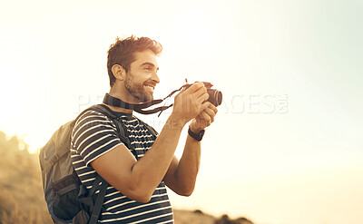 Buy stock photo Adventure, nature and man with camera, photography and smile with hiking, sunshine and journey. Outdoor, travel or guy with equipment, summer and happiness with holiday view, creative or backpack