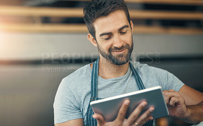 Buy stock photo Business, apron and man with tablet, typing and internet with digital app, barista and restaurant. Online order, person and entrepreneur with tech, schedule and waiter in cafe, network and service