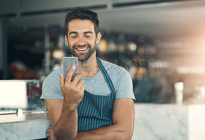 Buy stock photo Barista, man and mobile phone in cafe with apron for  communication, networking or restaurant app. Connection, small business owner and male person for social media, browsing internet or online order