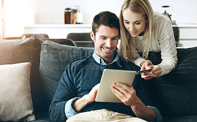 Buy stock photo Couple, tablet and credit card on sofa for online shopping, bills or banking with fintech app in living room. Man, woman and digital touchscreen for e commerce, sale and deal with discount in home