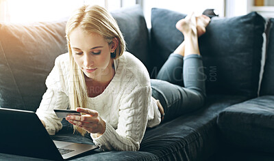 Buy stock photo Woman, laptop and credit card with payment on sofa for online shopping, ecommerce or wireless transaction. Person, shopper or paying for discount, financial investment or banking on in lounge of home