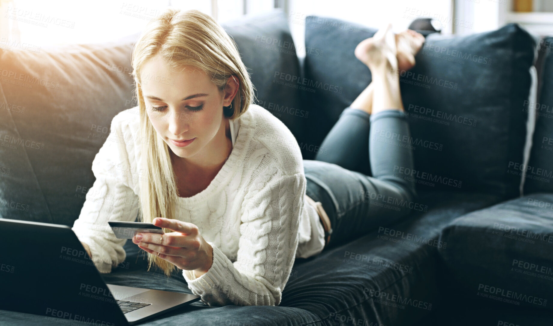 Buy stock photo Woman, laptop and credit card with payment on sofa for online shopping, ecommerce or wireless transaction. Person, shopper or paying for discount, financial investment or banking on in lounge of home