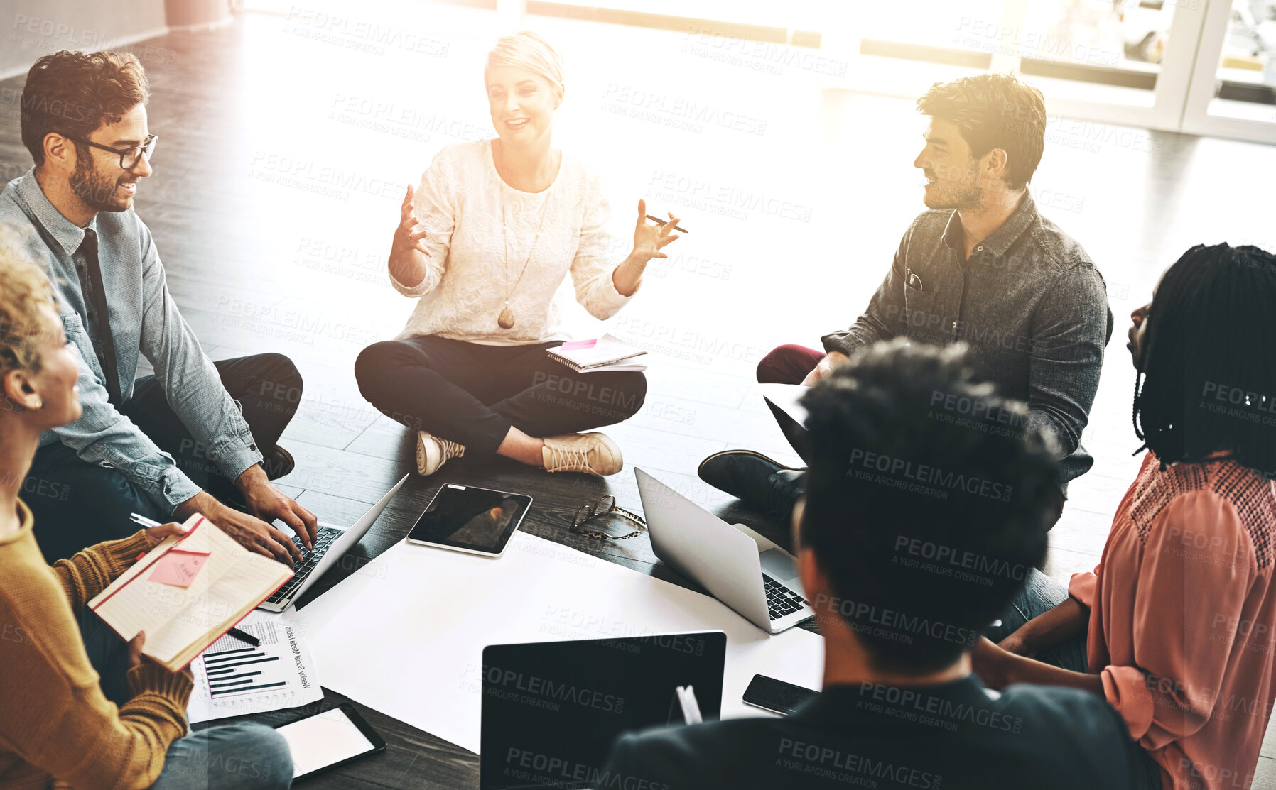 Buy stock photo Happy people, meeting and discussion with documents on floor for planning, creative strategy or collaboration at office. Group of young employee discussing project, ideas or brainstorming for startup