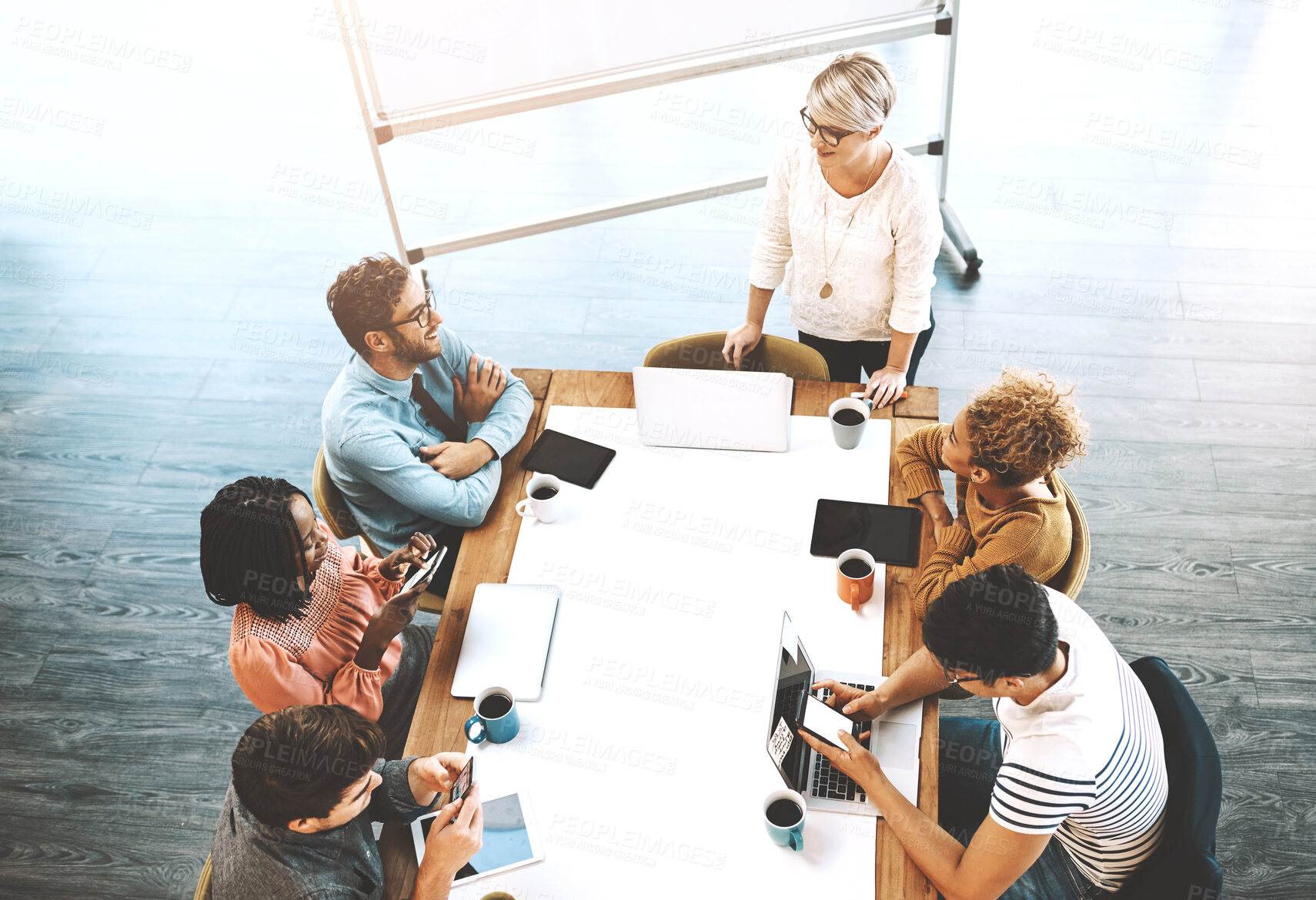 Buy stock photo Meeting, top view or business people in office for laptop presentation, brainstorming or planning solution. Digital agency, leadership or woman web design mentor with team for training or coaching