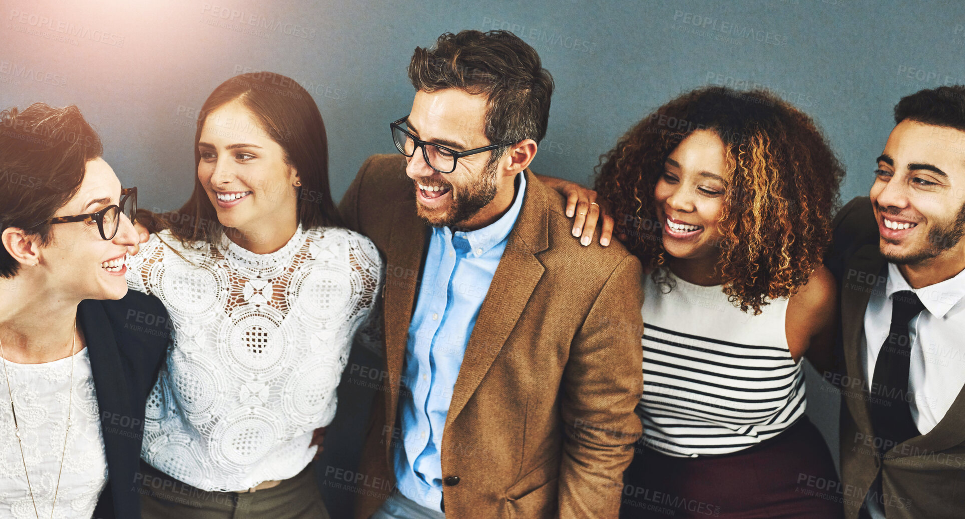 Buy stock photo Business, diversity and funny with group of friends in studio on gray background for collaboration. Corporate, teamwork or employee men and women laughing together for career, company or occupation