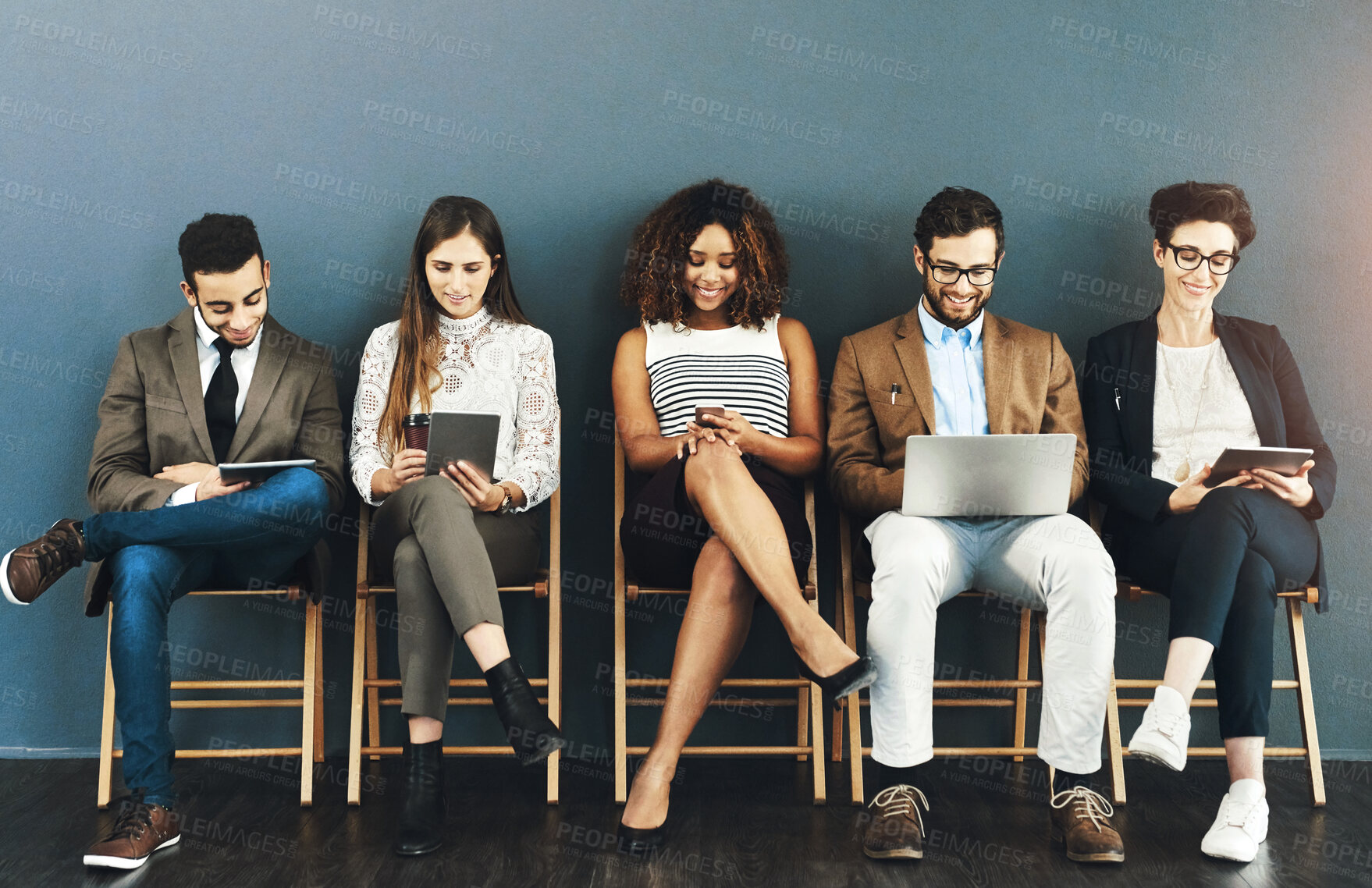 Buy stock photo Diversity, technology and business people in waiting room for interview, meeting or recruitment on chair. Hiring, human resources and candidates in office for opportunity, onboarding or employment