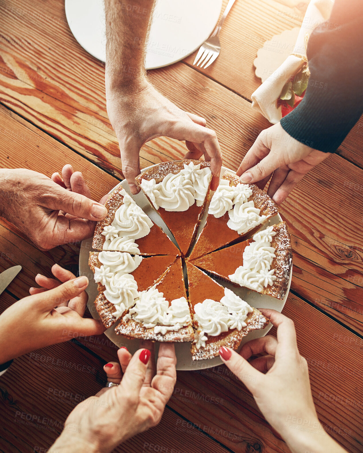 Buy stock photo Slice, hands and pumpkin pie for meal, people and Thanksgiving with celebration, cream and dessert. Above, catering and group with food, sweet snack or family with social gathering or event in home