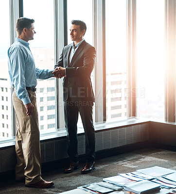 Buy stock photo Men, handshake and window in office for welcome, greeting and onboarding in modern workplace. Partnership, support and business people in Seattle for collaboration, deal and agreement for project