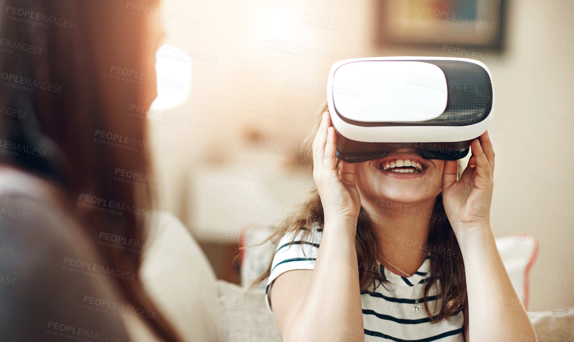 Buy stock photo Girl child, happy and vr on sofa for e learning, educational apps and digital adventure with cyber vision. Kid, home and virtual reality for metaverse or video game, online streaming and websites.