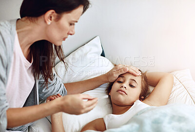 Buy stock photo Mom, girl child and sick in bedroom with hand for check on fever, parent with healthcare for daughter. Mother, kid and medical care in home for FLiRT Covid, support or help for virus with headache