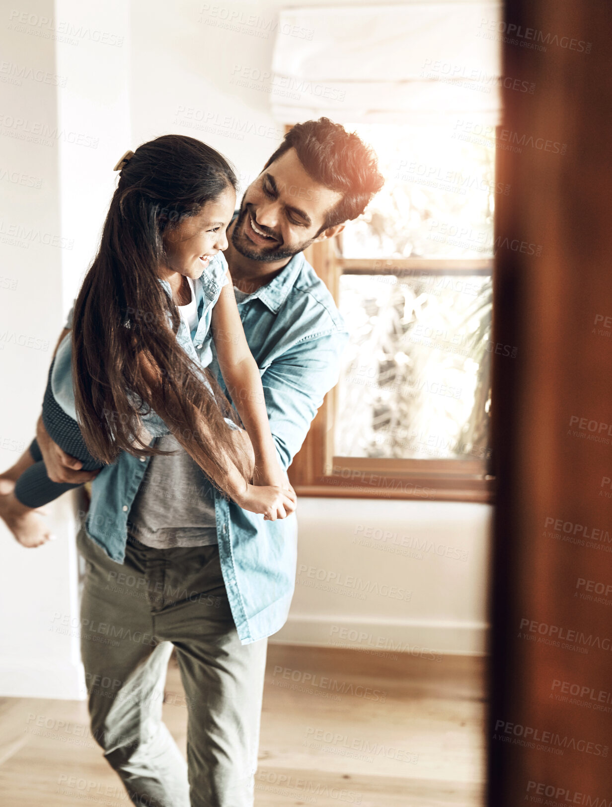 Buy stock photo Dad, playing and child in air with fun, love and bonding together in family home with smile. Morning, man and airplane game with care, funny father and young girl with laugh and flying in lounge 