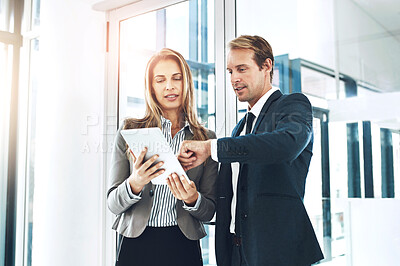 Buy stock photo Business people, partnership and tablet with discussion at workplace for briefing on b2b collaboration or project management. Team, digital tech and meeting on company growth and review on kpi goals