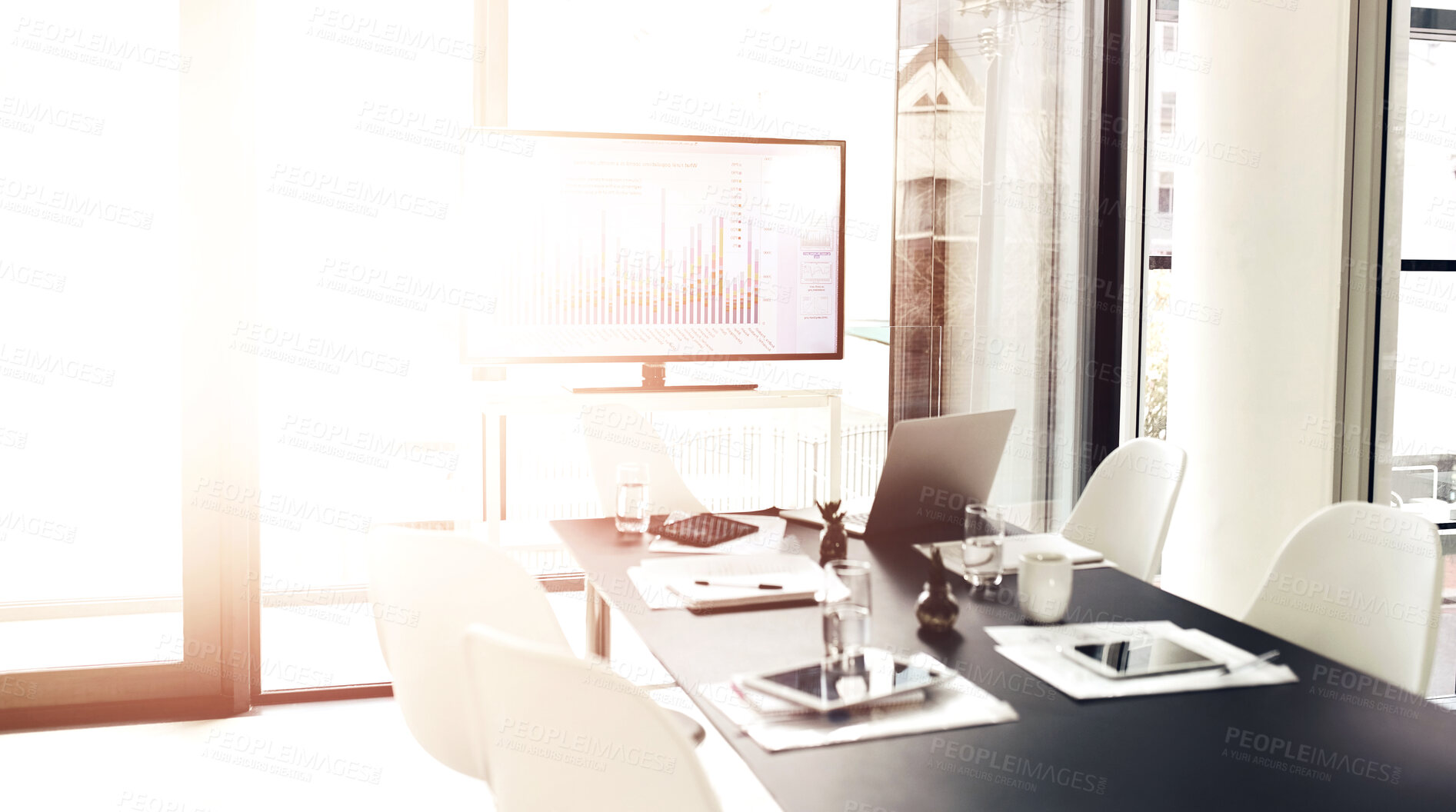 Buy stock photo Empty office, tv and conference room table for meeting with tablet, laptop or paperwork. Interior design, boardroom chairs and screen tech with information, statistics or data analysis on lens flare