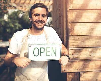 Buy stock photo Happy, waiter and man at cafe with open sign in confidence in startup, growth and ownership. Coffee shop, business and smile or satisfied at restaurant with welcome board or poster for customers