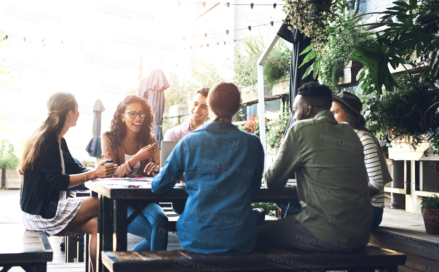 Buy stock photo Business people, discussion and meeting with team at cafe for collaboration, ideas or conversation. Young group of happy or creative employess discussing project for startup at outdoor coffee shop