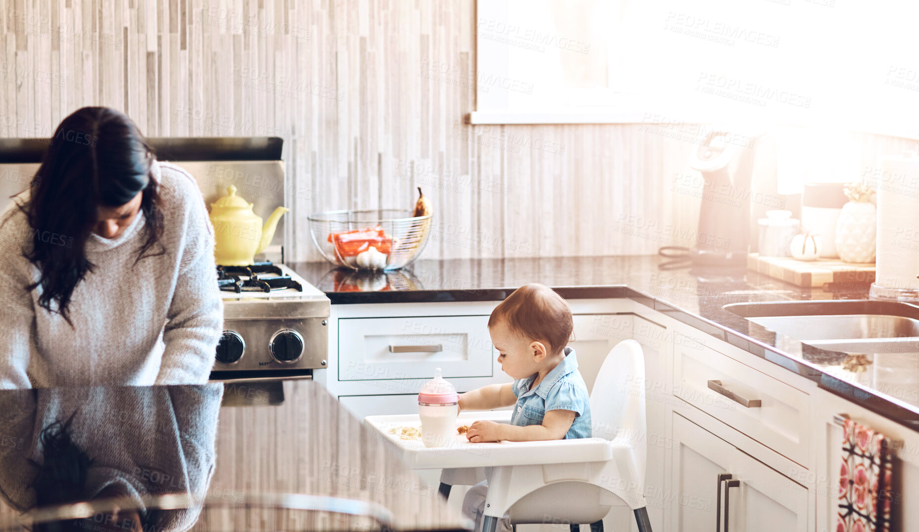 Buy stock photo Kitchen, mom and baby in high chair on day off in home with playing and busy with house keeping. Parent, woman and toddler for child development or growth with care, support and trust or bonding