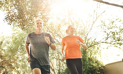 Buy stock photo Happy, senior couple and nature with running for fitness, cardio training and bonding together. Low angle, woman and man with smile in sunshine for outdoor exercise, healthy body and support in sport