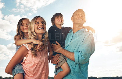 Buy stock photo Family, happy and sky outside or piggyback in nature, people vacation and children smile for bonding. Relationship, parenting and holiday together for fun, summer break and playful or laughing