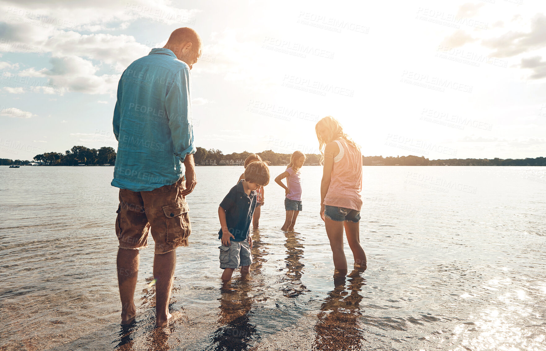 Buy stock photo Family, water and vacation in beach, bonding and travel for summer, holiday and break in nature  of California. Parents, kids and adventure in tropical, sea and man with woman, together and children