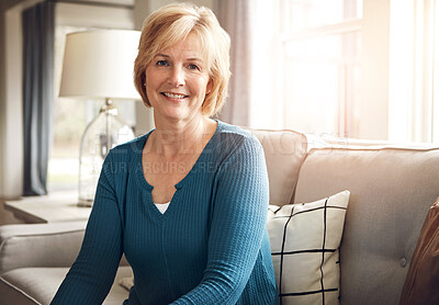 Buy stock photo Happy, calm and portrait of mature woman on a sofa with confidence, peace and positive attitude in her home. Face, smile or female person relax in living room with peaceful, morning or break in house