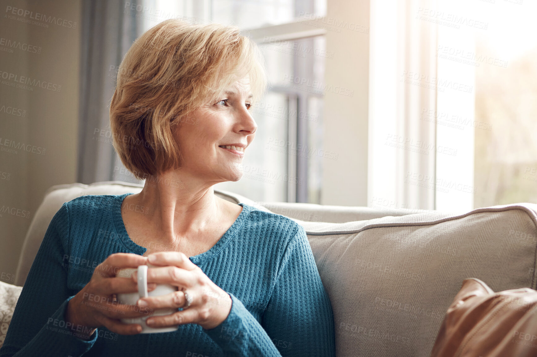 Buy stock photo Coffee, thinking and mature woman on sofa with hot beverage, tea and caffeine by window. Retirement, morning and happy senior person with drink for wellness, calm and thoughtful in living room