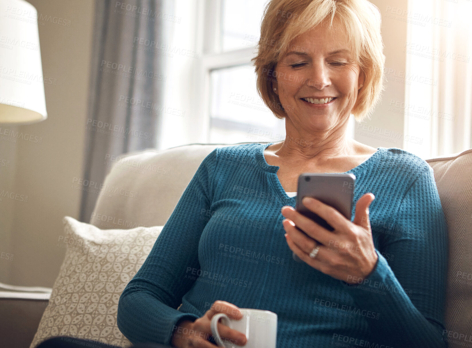 Buy stock photo Home, relax and old woman on sofa with smartphone, typing and connection with reading in living room. Senior person, apartment or mature lady with cellphone, internet and digital app with coffee