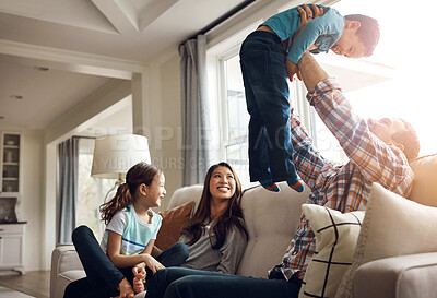 Buy stock photo Family, dad and airplane with son on sofa for fun, childhood memory and together with love or playful support. Father, boy and bonding in living room in home with mom or sibling, affection and happy.