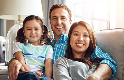 Buy stock photo Interracial parents, girl and portrait on sofa with smile, hug and relax with care, diversity and happy in family home. Father, mother and daughter with embrace, connection and love on lounge couch